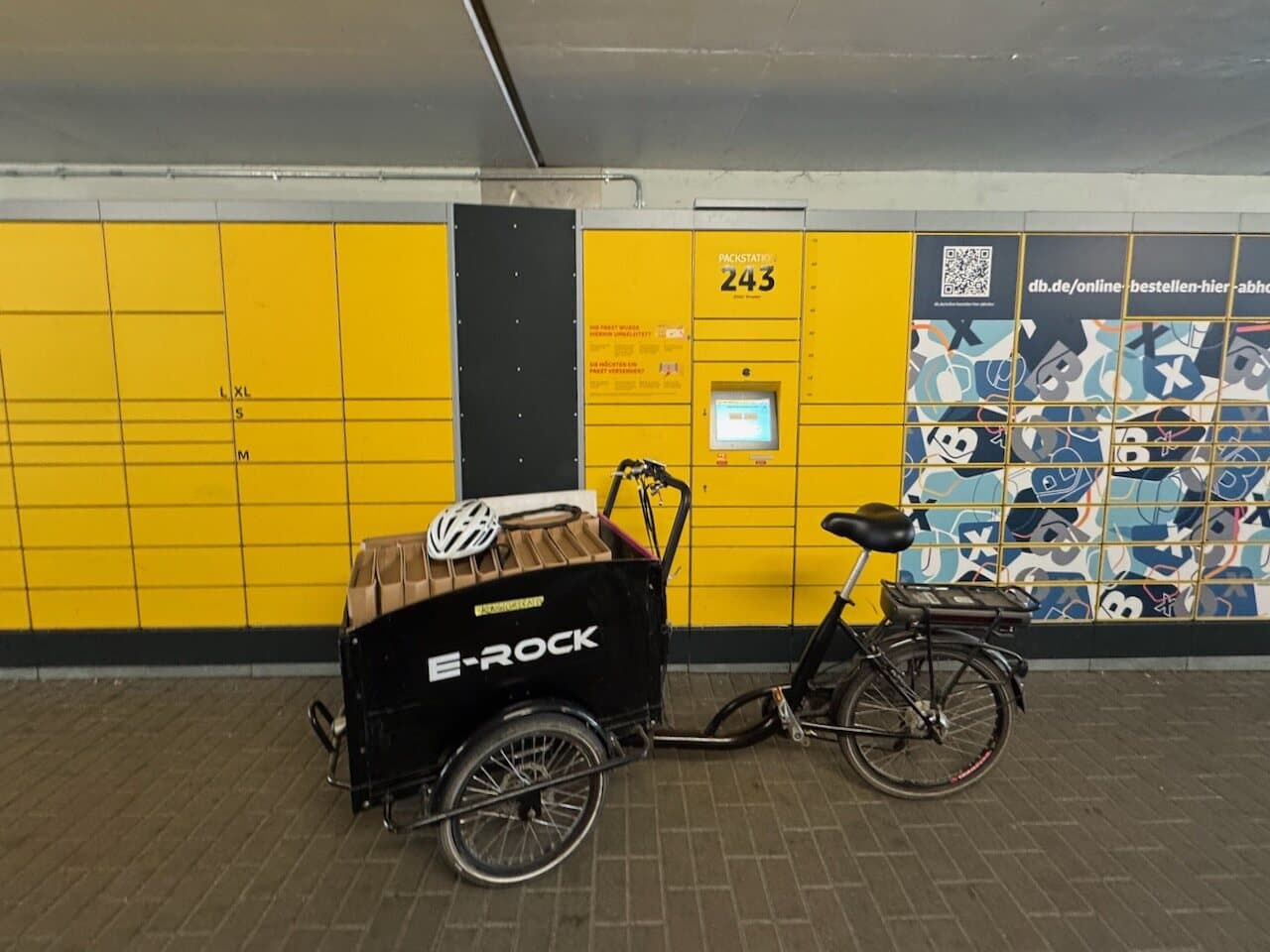 Packed orders transported by cargo bike to a DHL Packstation