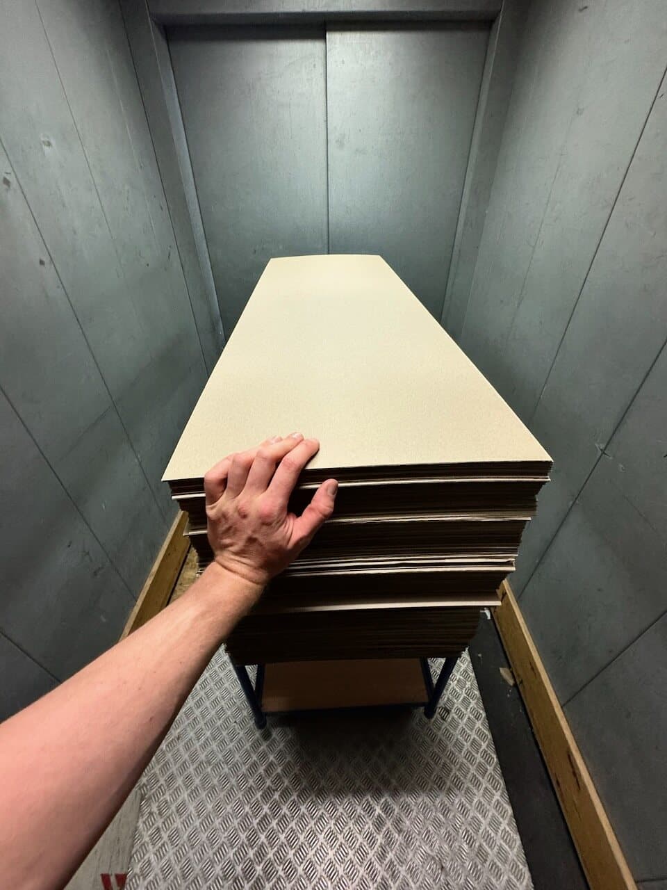 Protective cardboard inlays ready for a packing batch